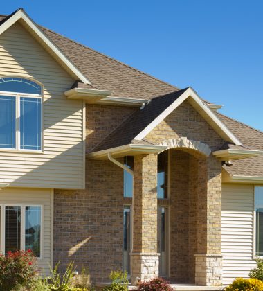 Mixed Materials House With Stone, Brick, Vinyl Siding